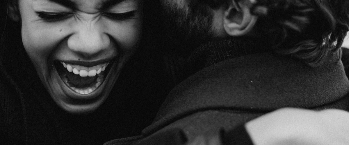 pexels photo 3692749 3692749 Monochrome image of a joyful couple embracing with laughter and happiness outdoors.
